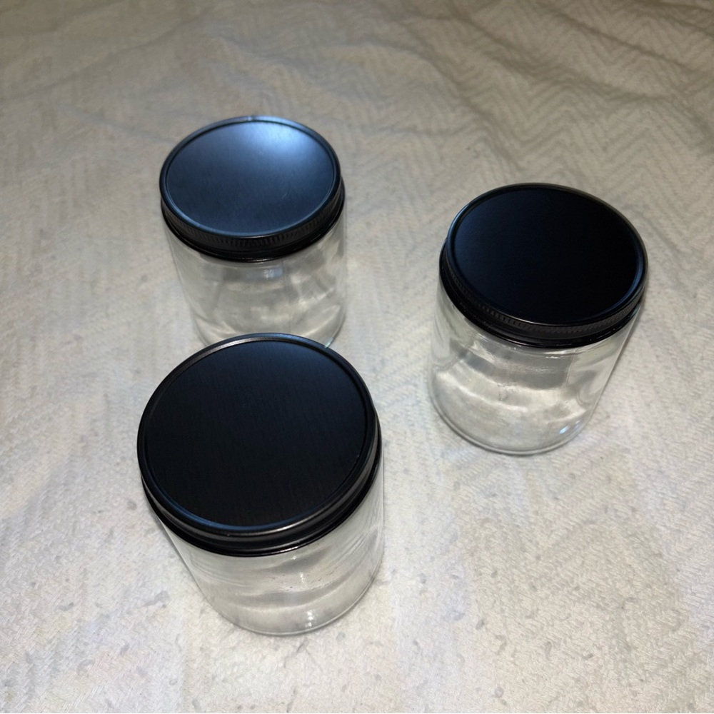 Three Clear Jars with Black Lids
